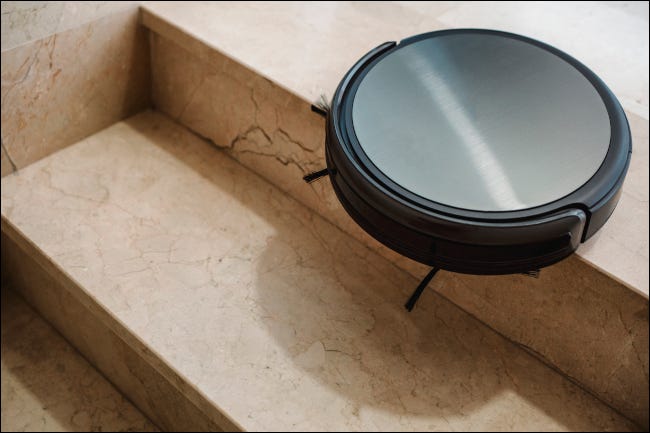 Robot vacuum on the edge of a staircase