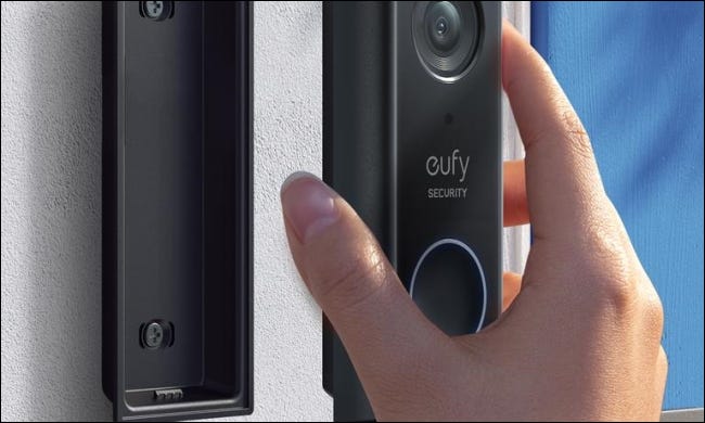 person setting up eufy doorbell