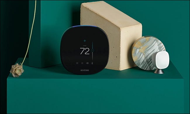 ecobee smart thermostat on green table