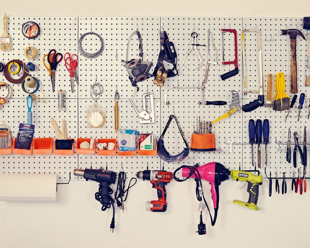 tidy peg wall holding varied tools used by taxidermist